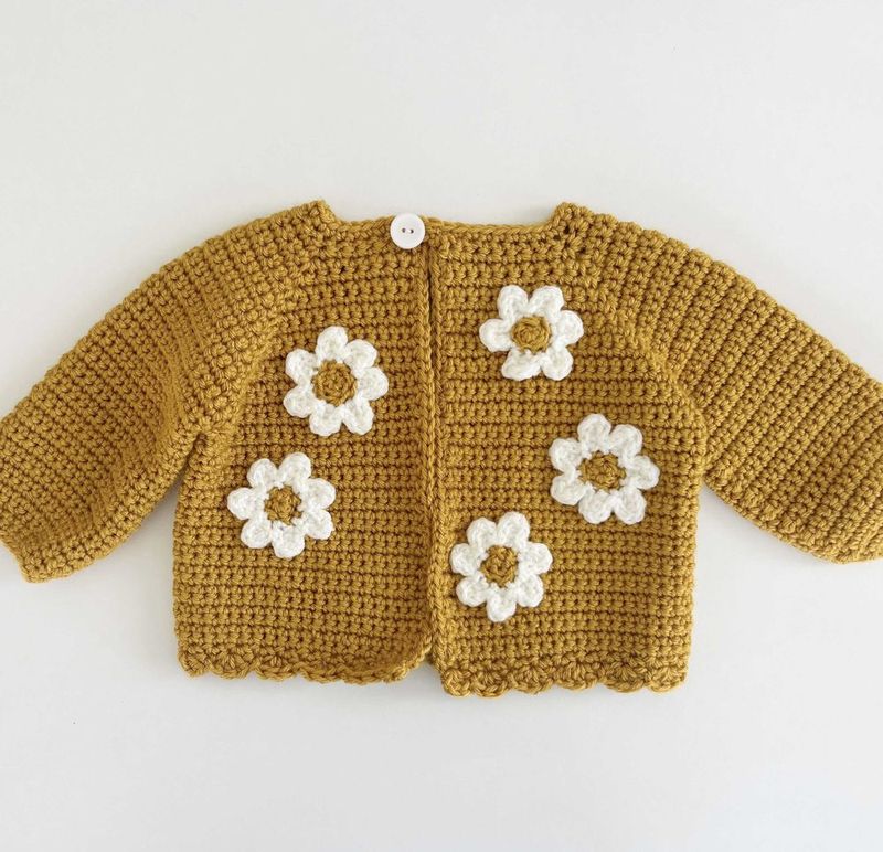 Single Crochet Baby Sweater With Daisy Flowers free crochet pattern by Tiffany